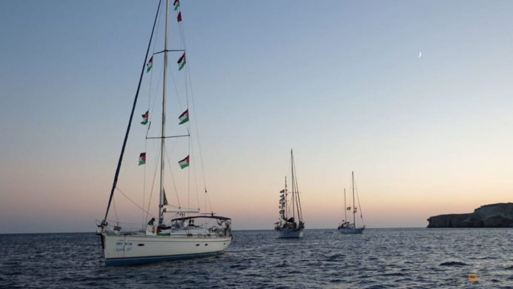 Gaza flotilla says Israeli vessels intimidated its boats as it nears blockade