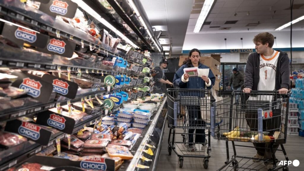 US revises first quarter growth down while inflation climbs