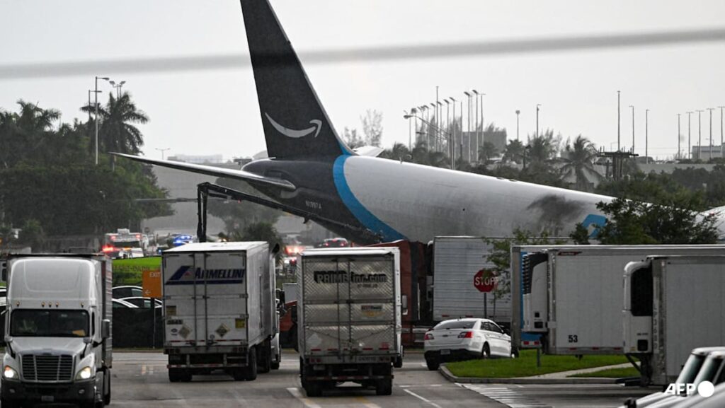 Amazon cargo plane overshoots Miami runway, hits vehicles, catches fire